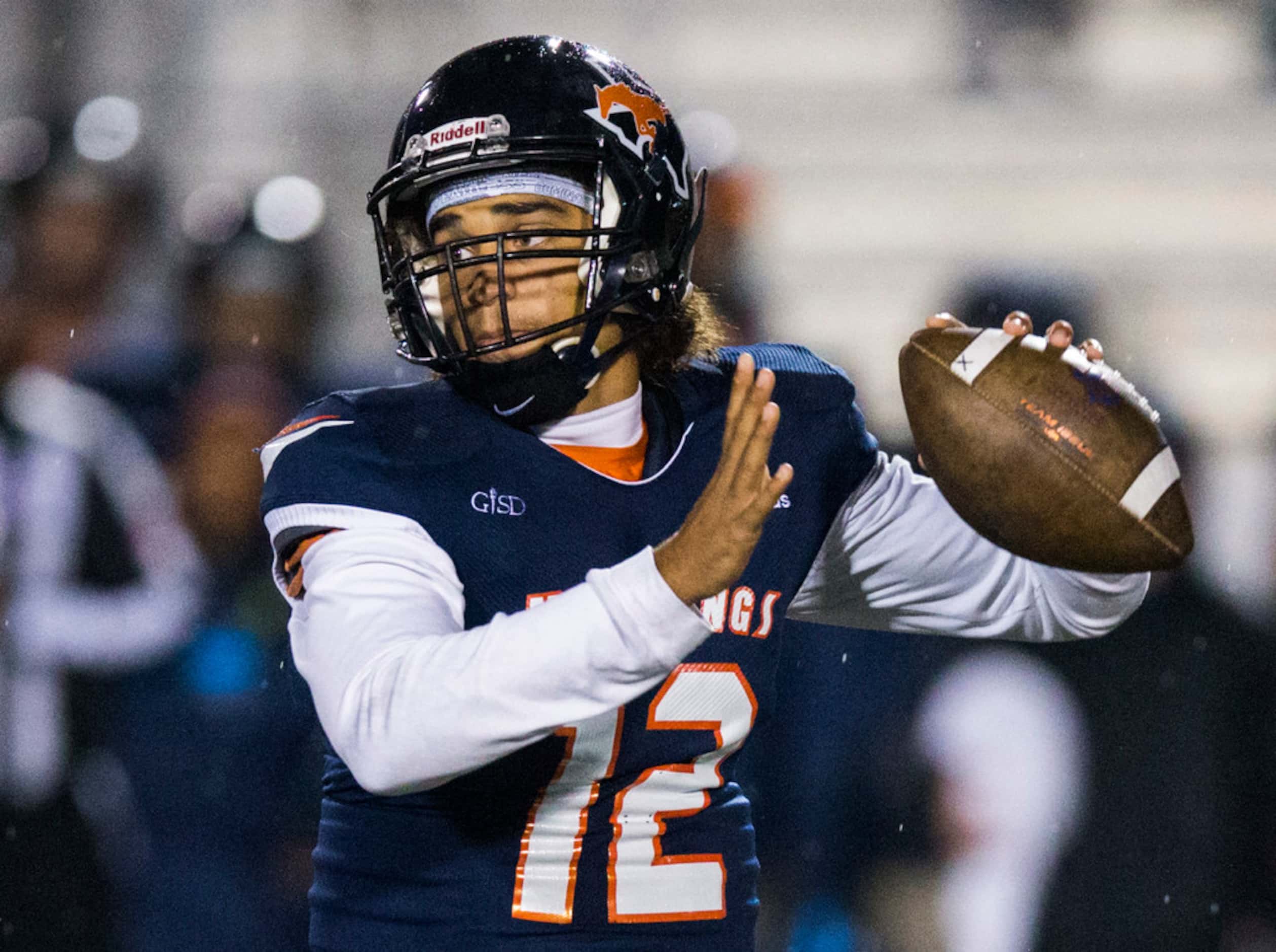 Sachse quarterback Xavier Forman (12) looks for a receiver during the second quarter of a...