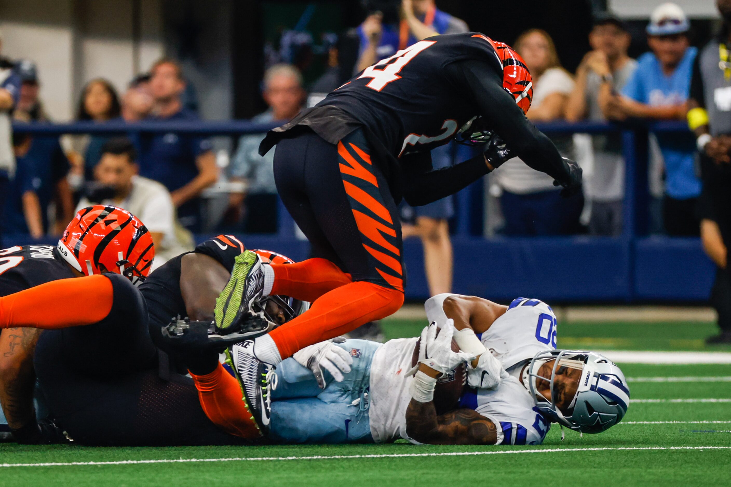 Dallas Cowboys running back Tony Pollard (20) gets tackled during the first half at the AT&T...