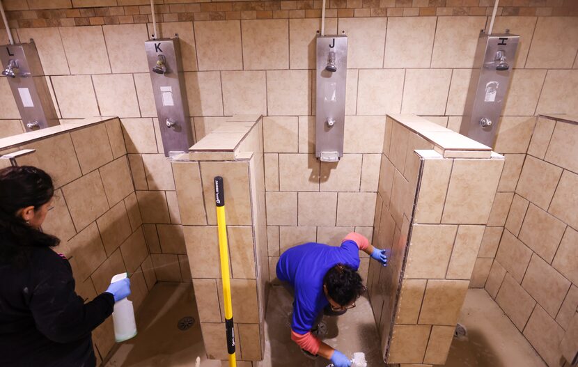 Members of Supreme Green Commercial Cleaning prepare the vacated former headquarters of...