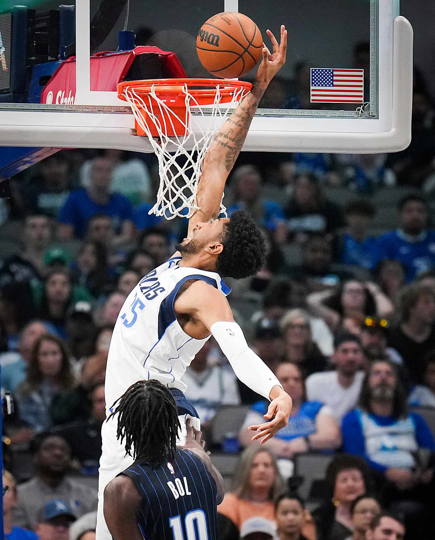 Dallas Mavericks center Christian Wood (35) lays the ball up past Orlando Magic center Bol...