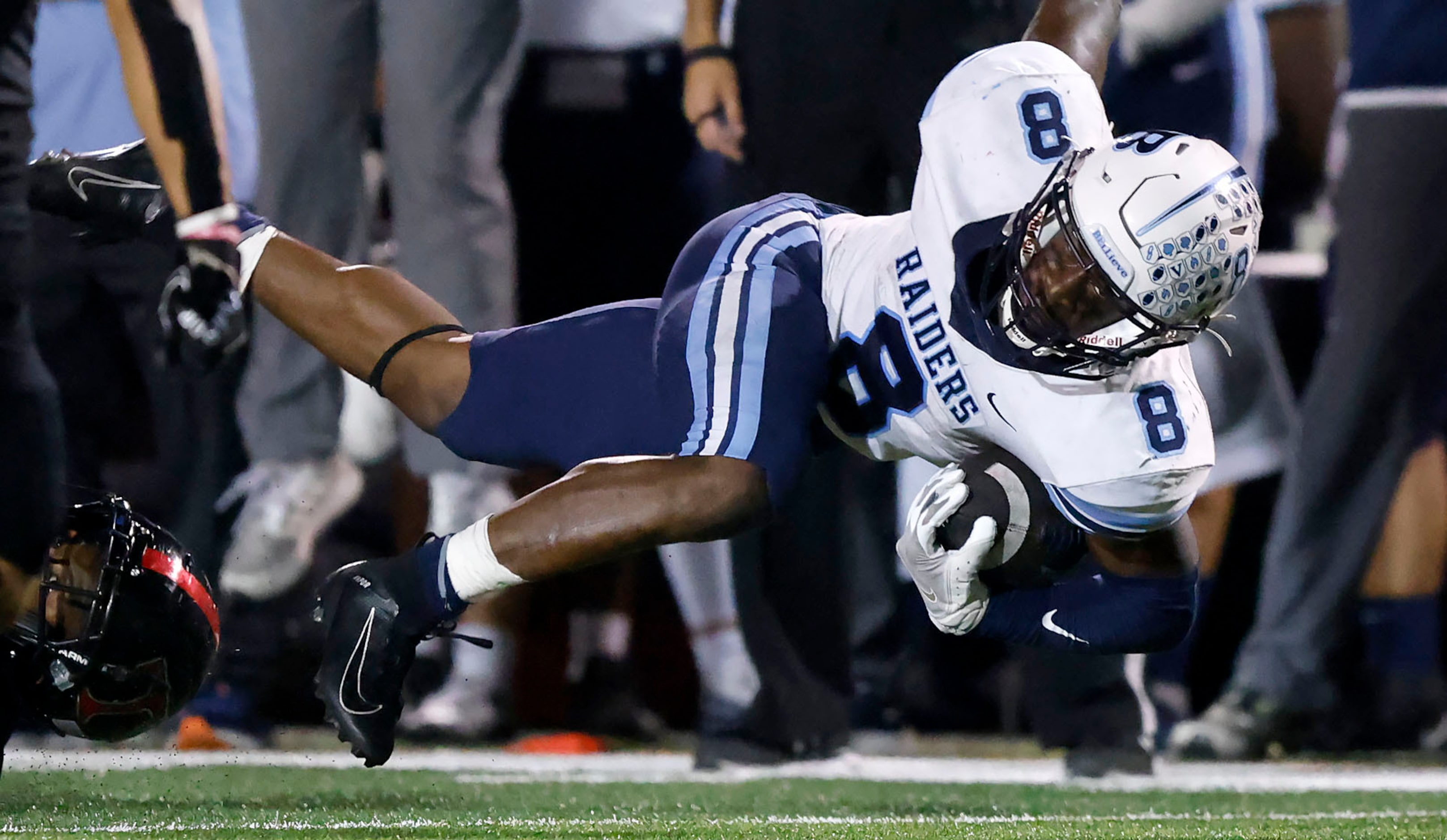 Hurst L.D. Bell running back Gracien Anto (8) is tripped up as he ran the ball against...