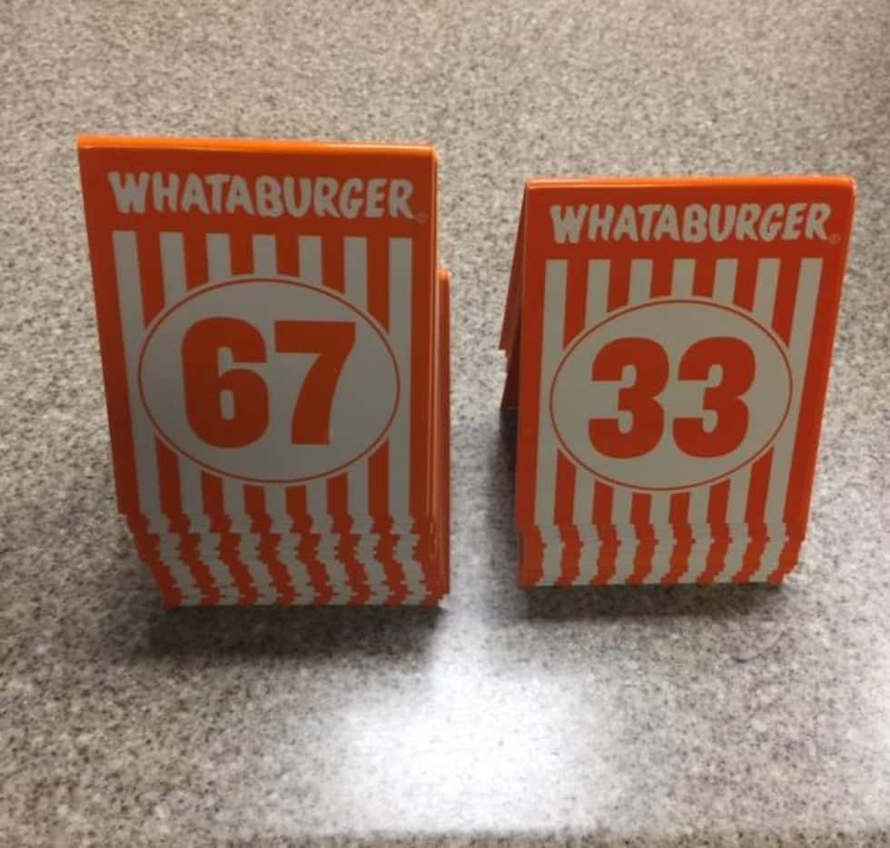 Stack of Whataburger numbers recovered by police, left, and those remaining in the restaurant. 