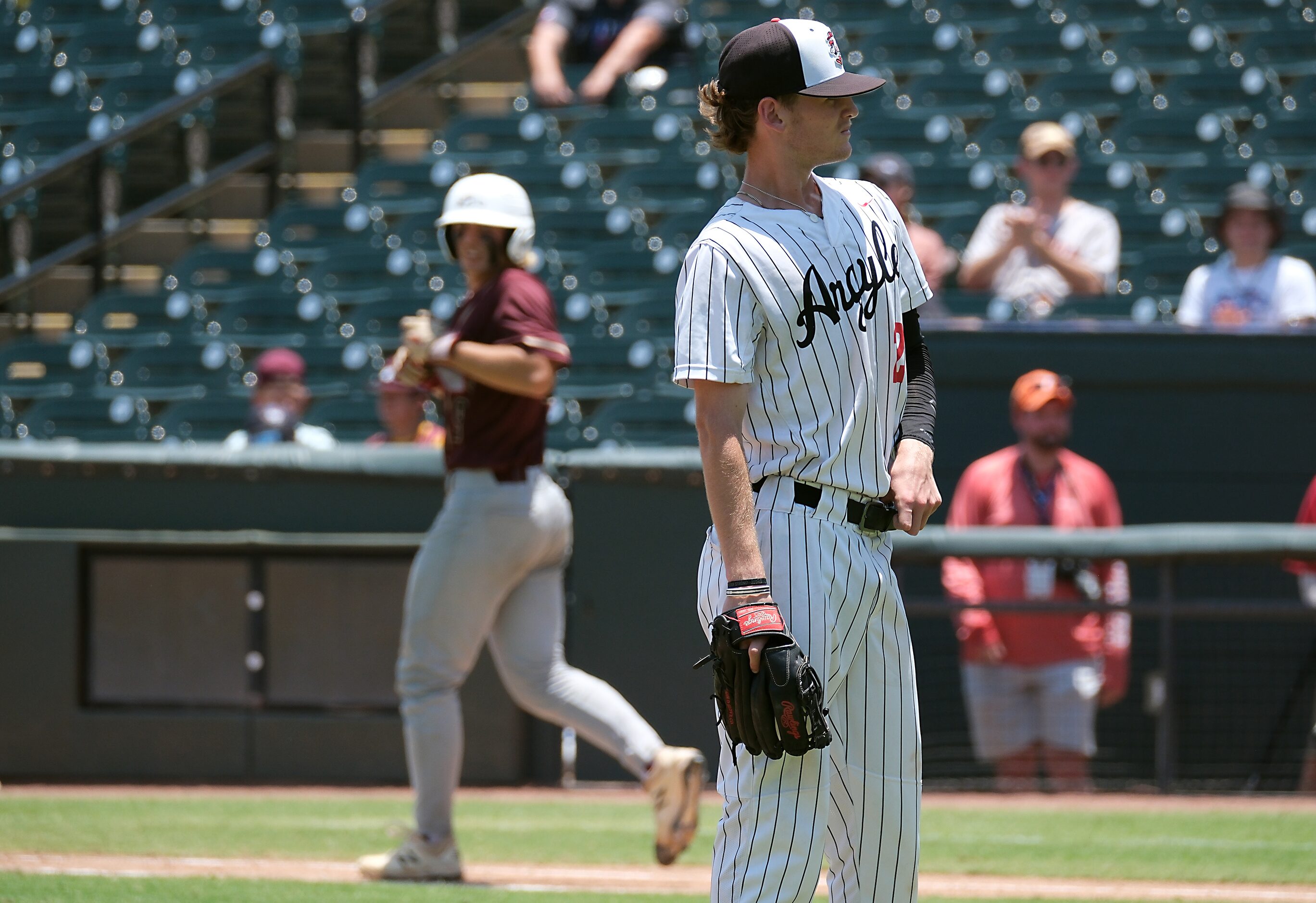 Argyle pitcher, Alex D’Angelo, (2), waits for Martin West batter Caylon Dygert, (9), to walk...