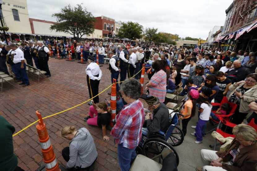 Hundreds attended Tuesday’s ceremony in downtown Farmersville, some hanging out of windows...