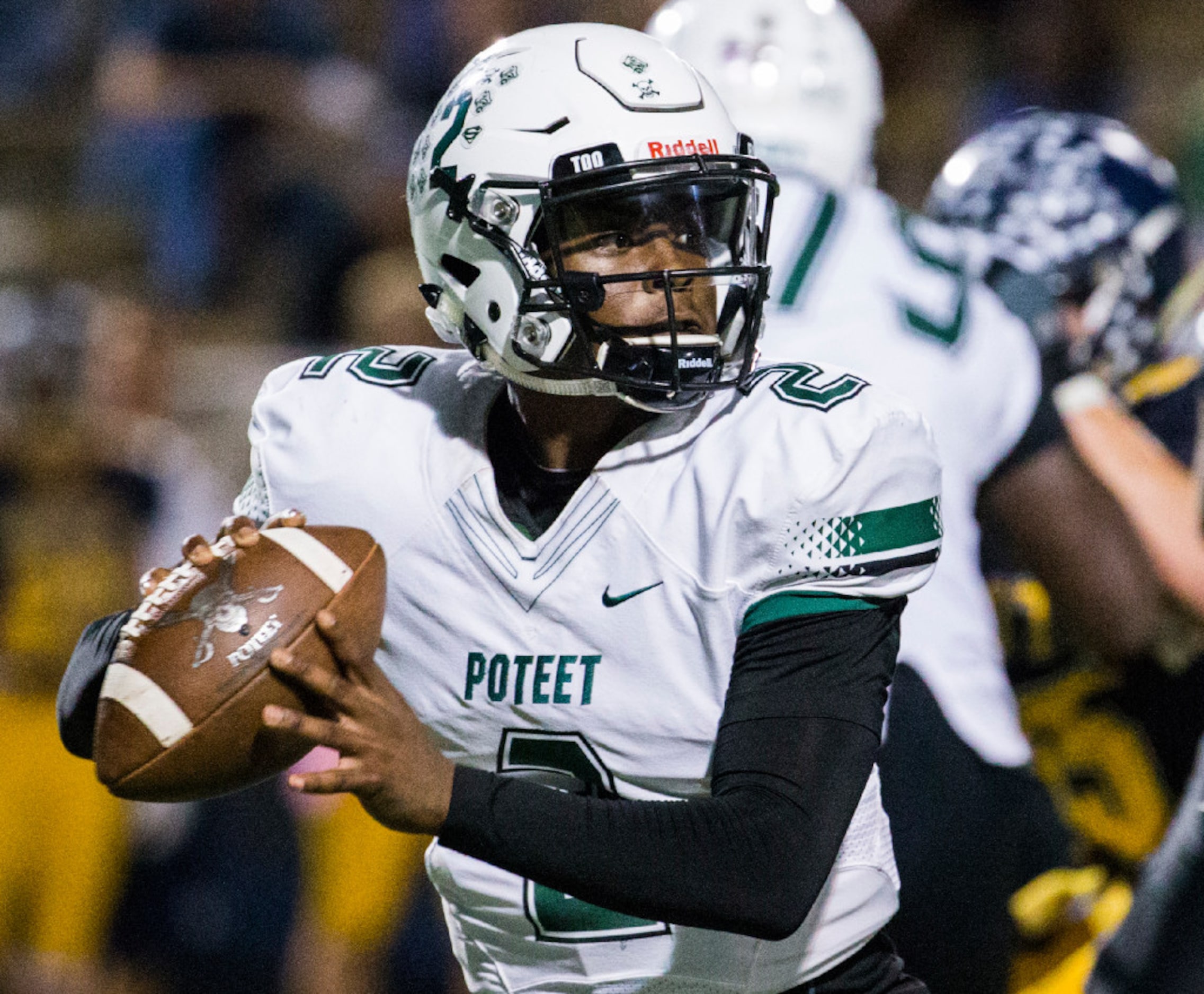 Mesquite Poteet quarterback Kaleb Fletcher (2) looks for a receiver during the fourth...