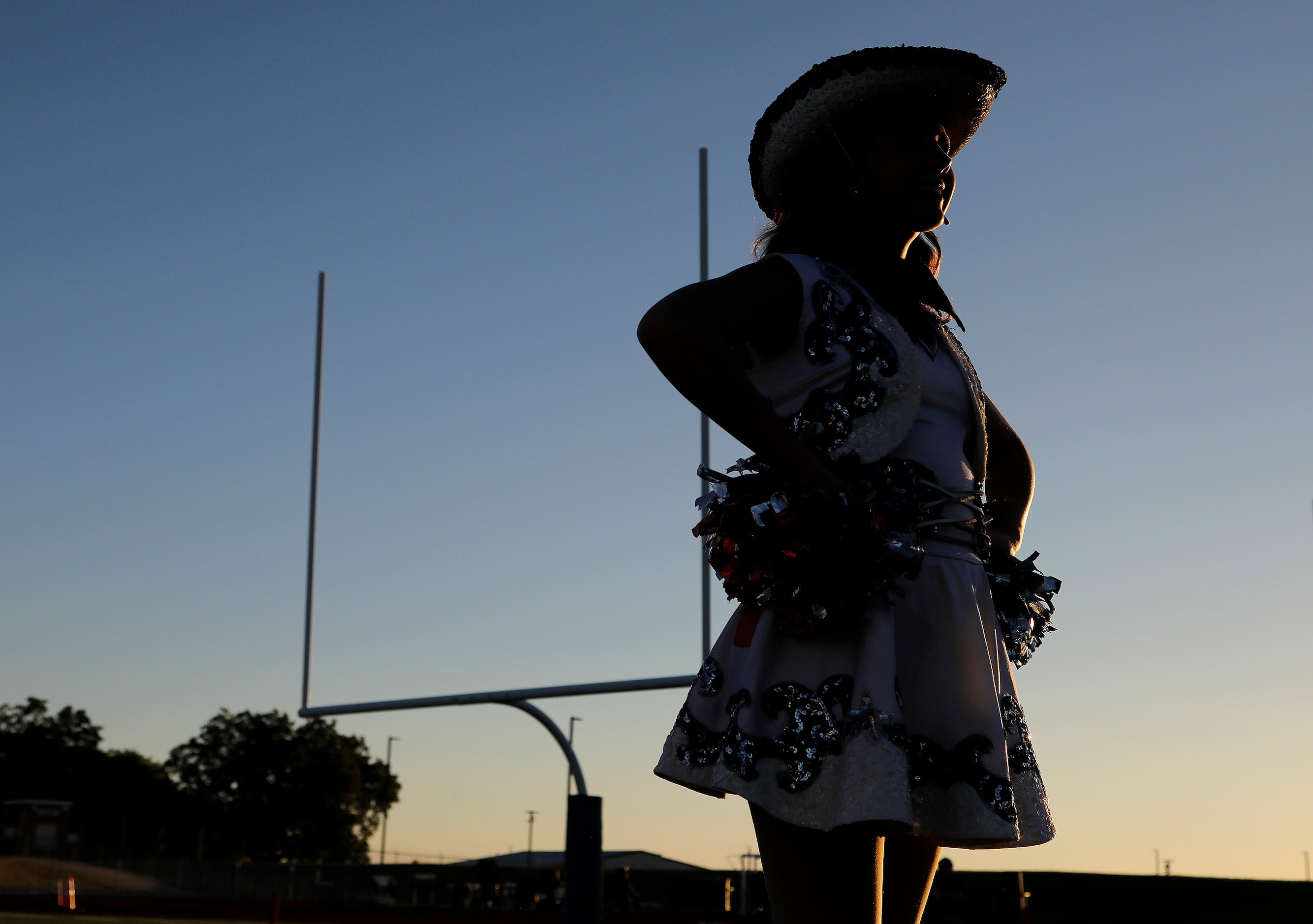 Allie Critchfield, 16, stands at attention with the McKinney North High School Northstars...