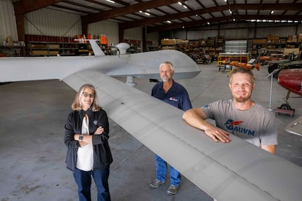 (From left) Paula Field, poses with brother Douglas Smith and nephew Marshall Smith next to...