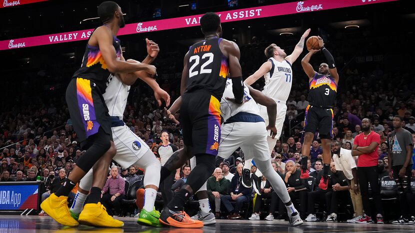 Dallas Mavericks guard Luka Doncic (77) blocks a shot by Phoenix Suns guard Chris Paul (3)...