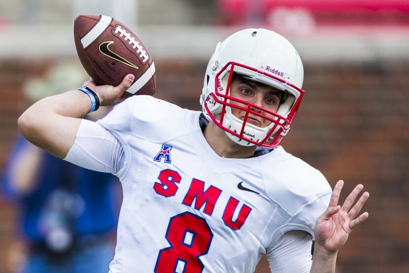 Southern Methodist Mustangs quarterback Ben Hicks (8) throws a pass during the first half of...