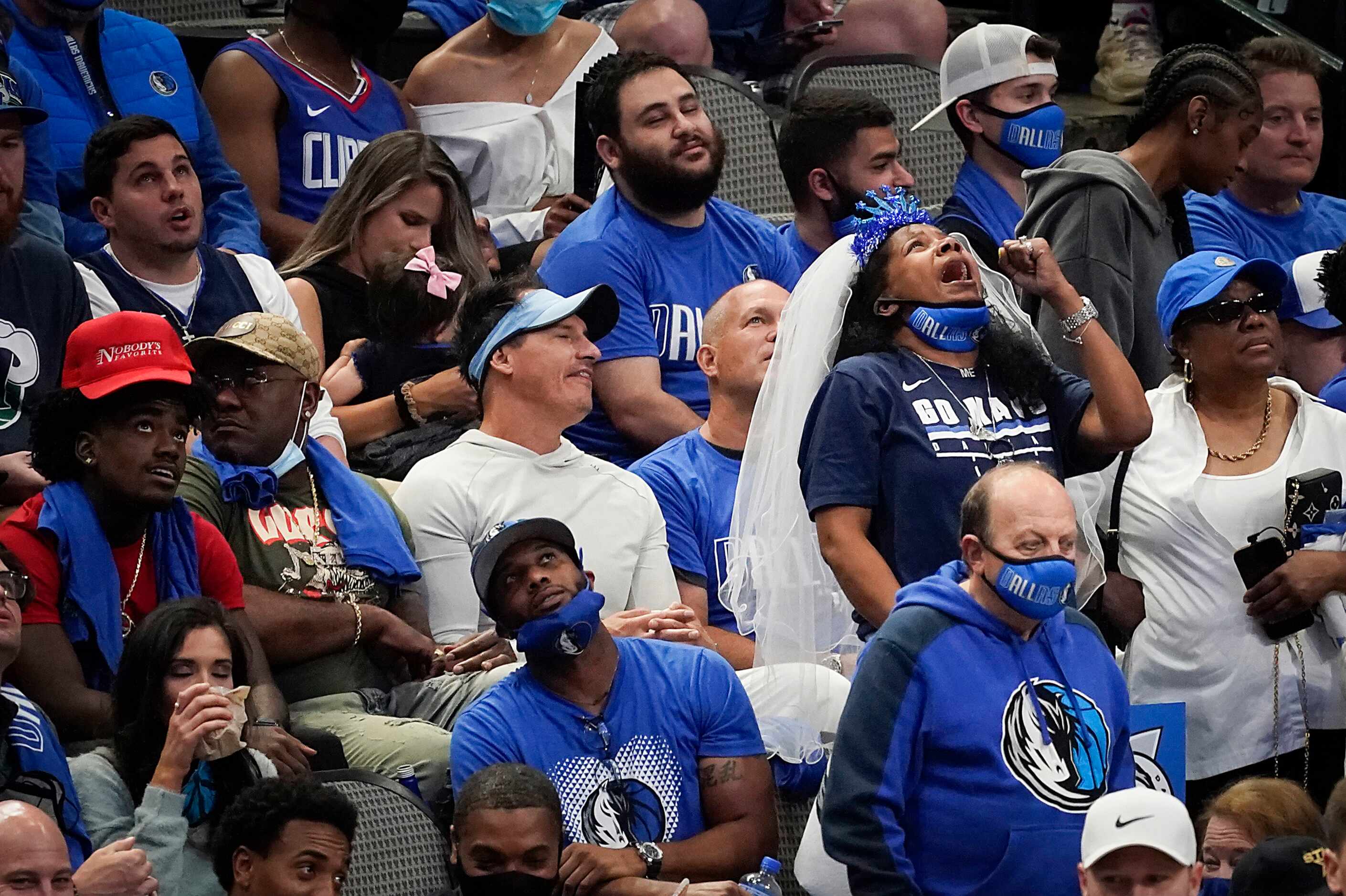 A Dallas Mavericks fan reacts to a play during the fourth quarter of an NBA playoff...