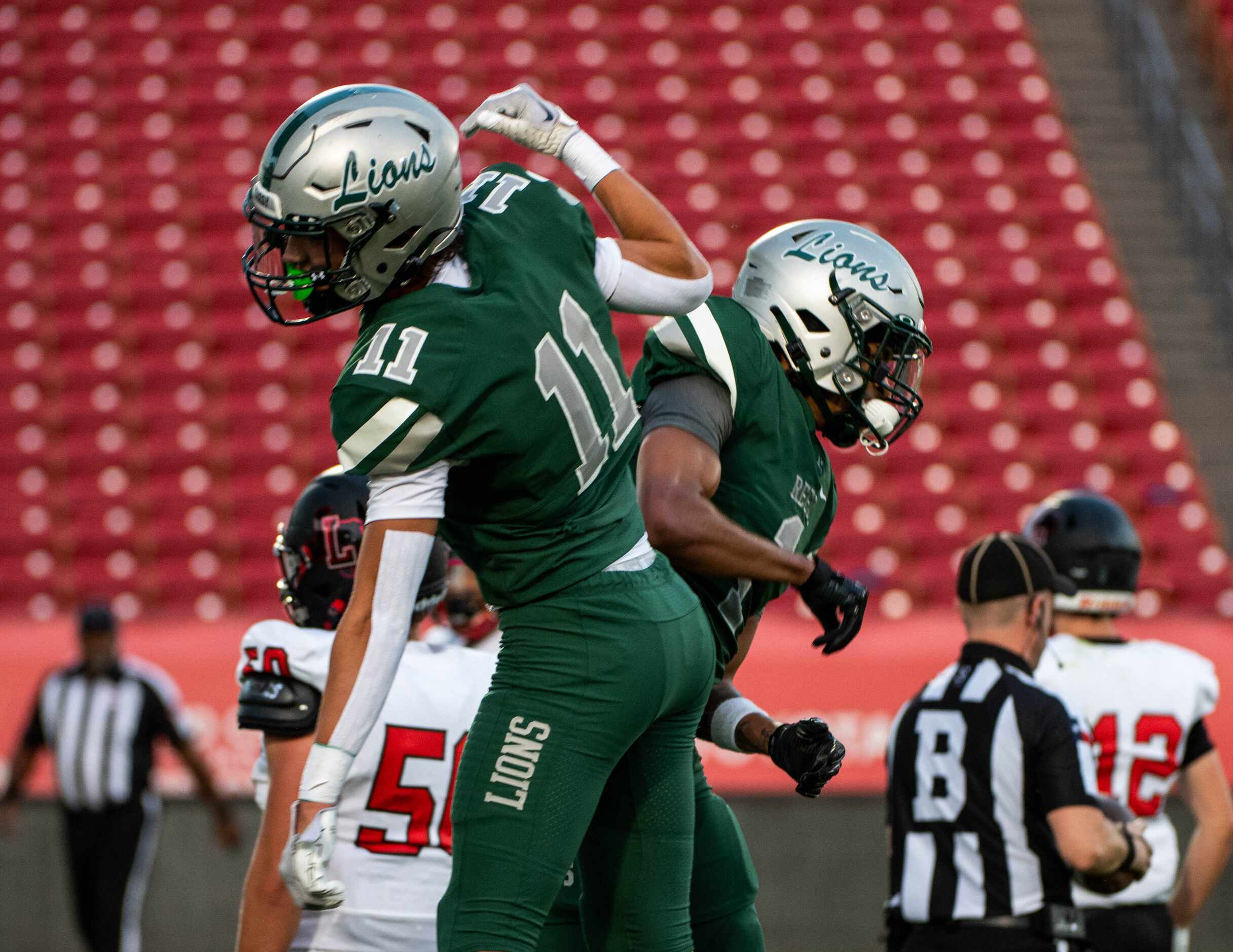 Frisco Reedy's Connor McGrath (11) and Kaleb Smith (1) celebrate after Smith’s touchdown...