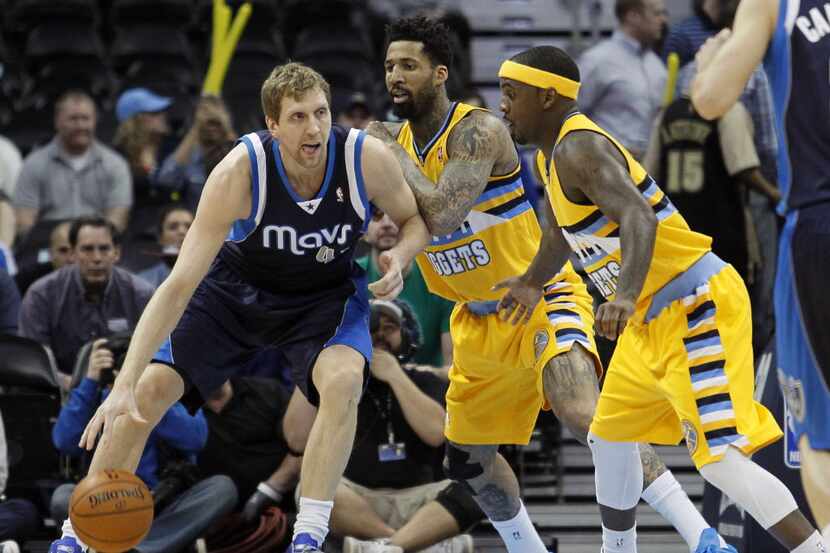 Mar 5, 2014; Denver, CO, USA; Denver Nuggets point guard Ty Lawson (3) watches as shooting...