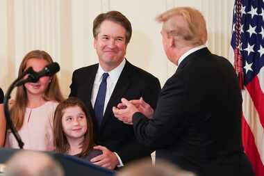 Judge Brett Kavanaugh, President Donald Trump's nominee for the Supreme Court,  with his...