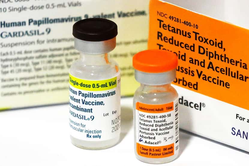 Vials of immunization medicine are pictured at the Dallas Mayor's Back to School Fair held...