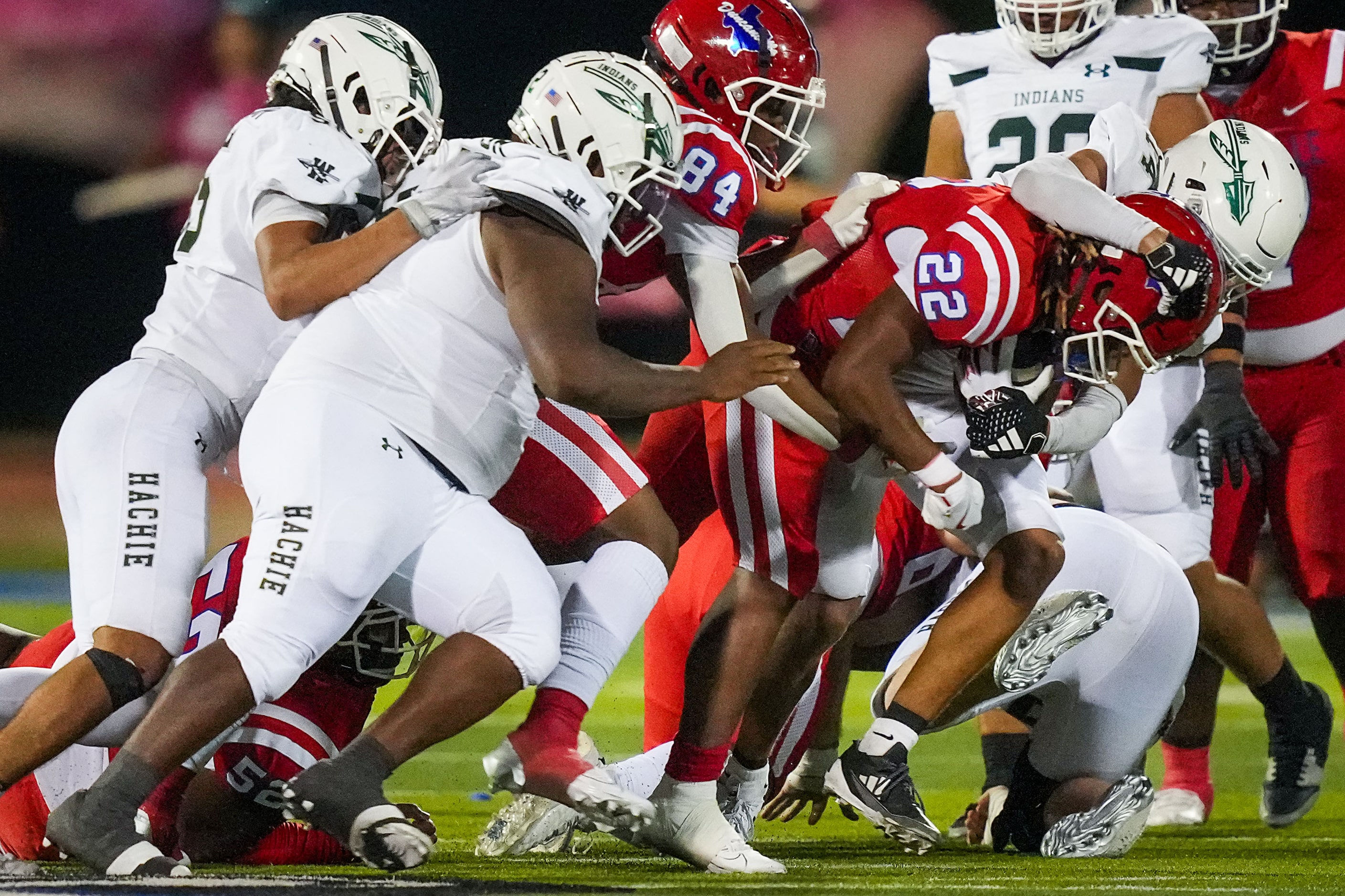 Duncanville running back Joe McKinney (22) is brought down by the Waxahachie defense during...