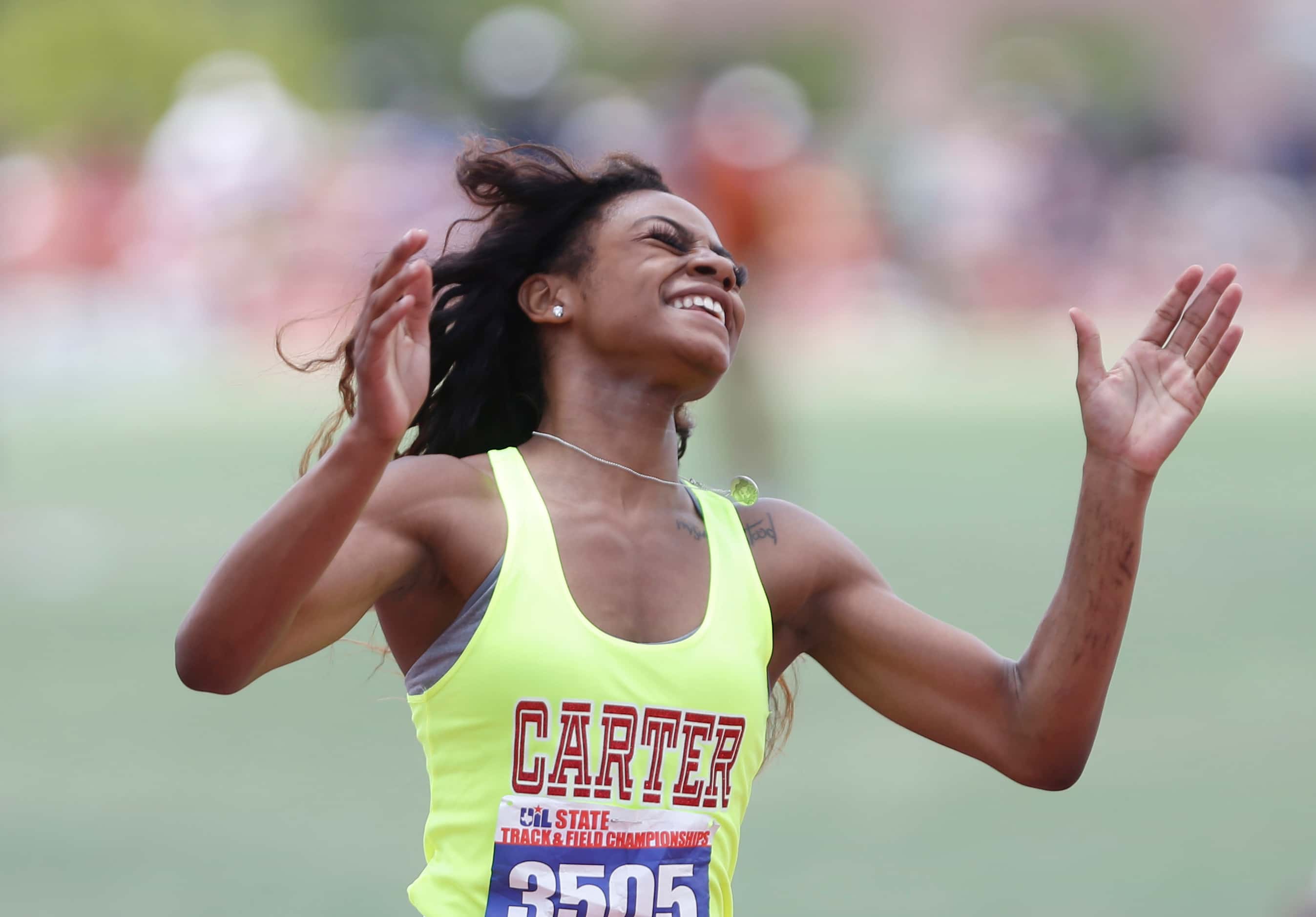 Dallas Carter's Sha'Carri Richardson celebrates after winning the Class 4A girls 100-meter...