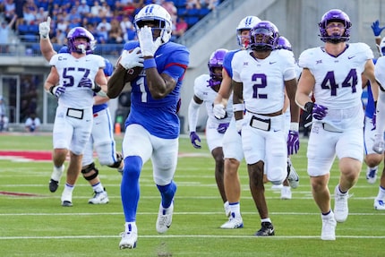 SMU running back Brashard Smith (1) celebrates as he scores on a 25-yard touchdown run...