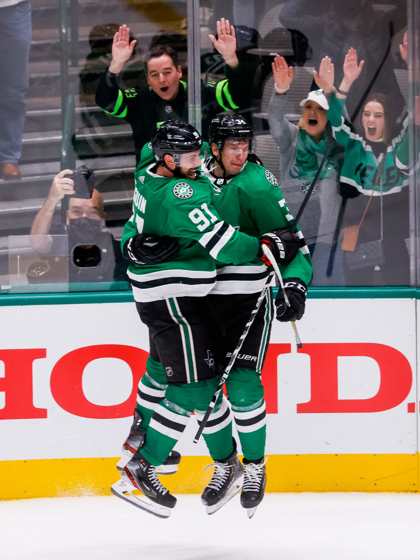 Dallas Stars right wing Denis Gurianov (34) celebrates with Dallas Stars center Tyler Seguin...