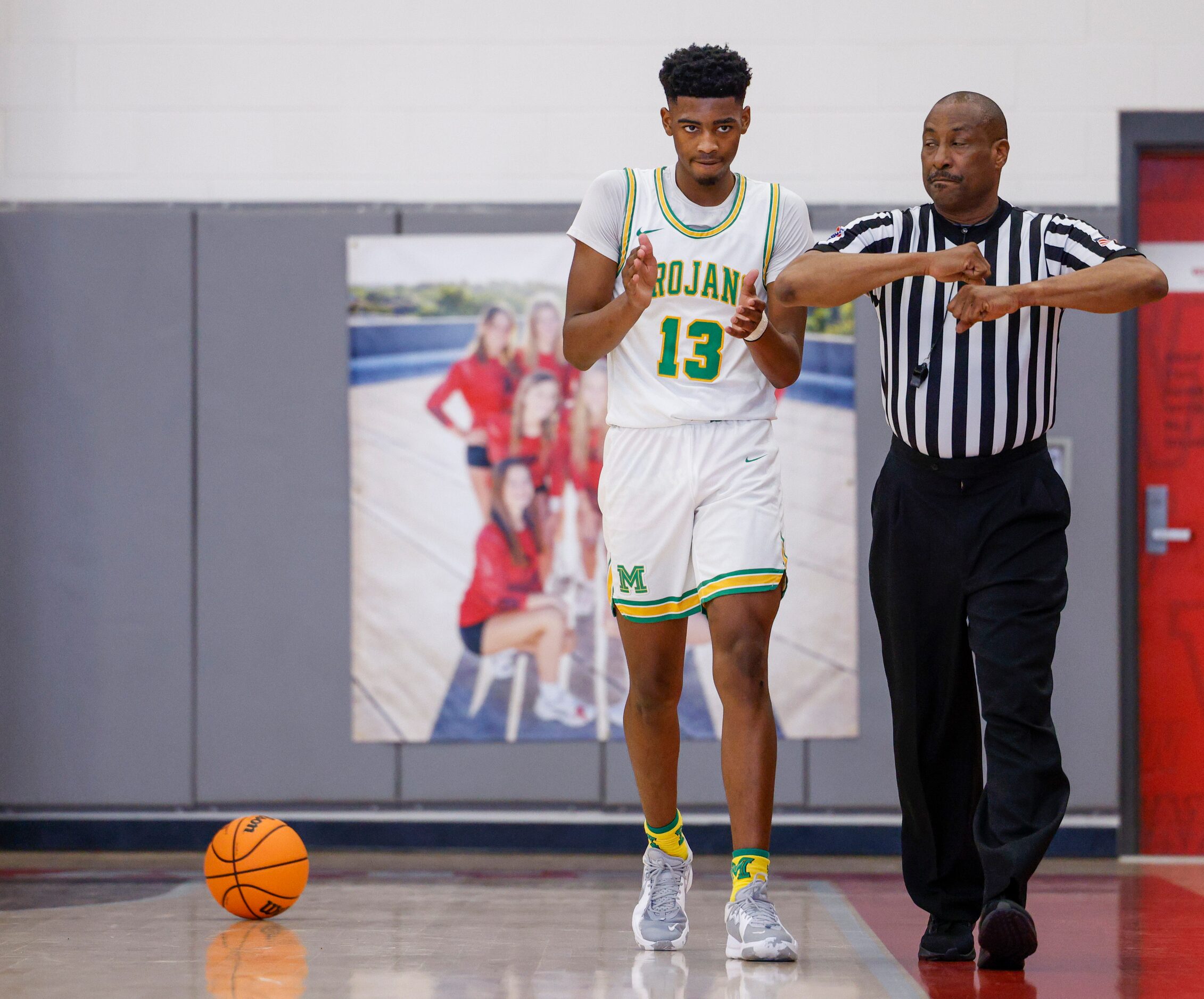 Madison forward Quintin Spencer (13) celebrates a called travel against W.T. White during...