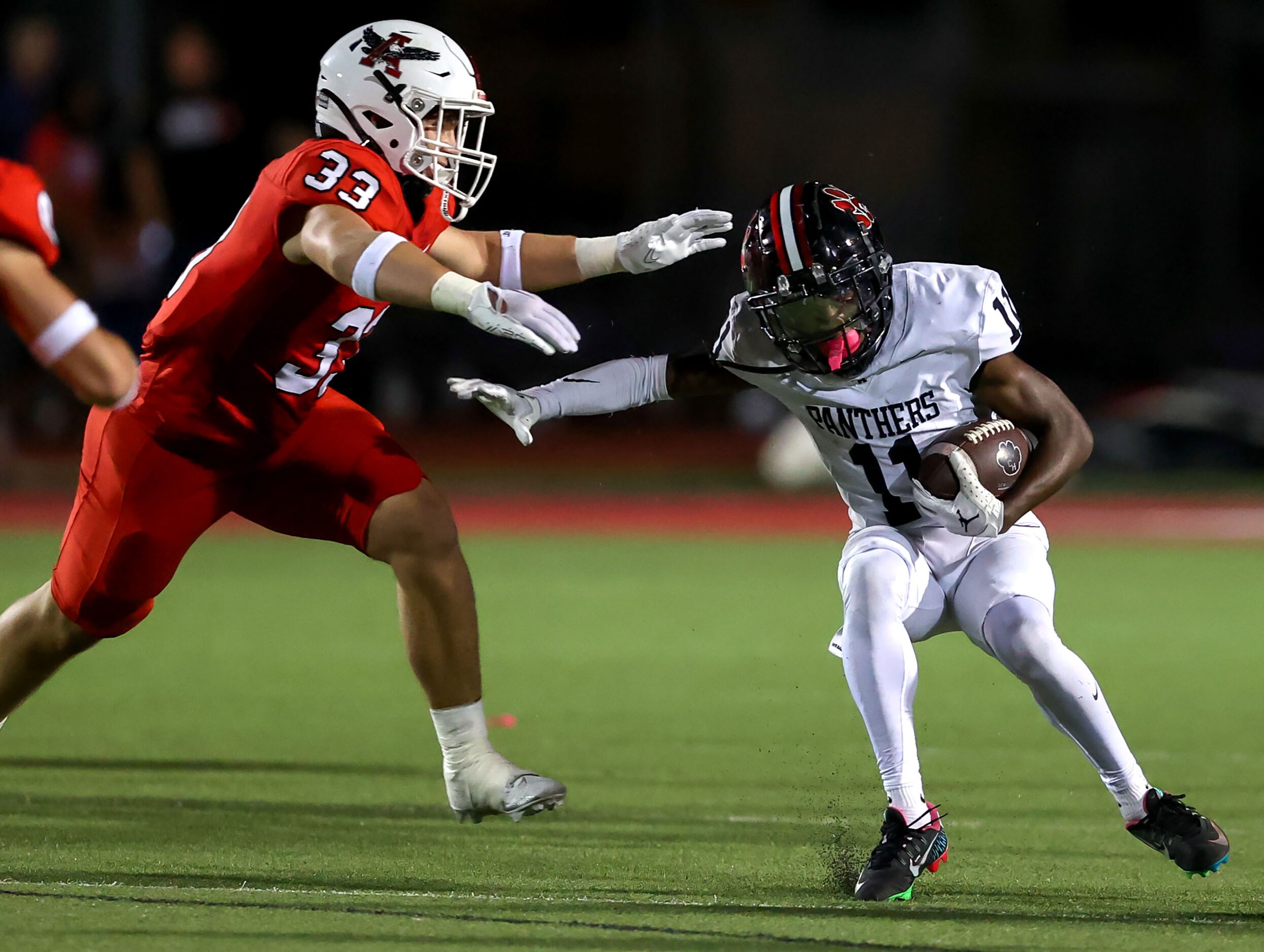 Colleyville Heritage running back Jerrod Wiley (11) tries to avoid Argyle linebacker Brody...