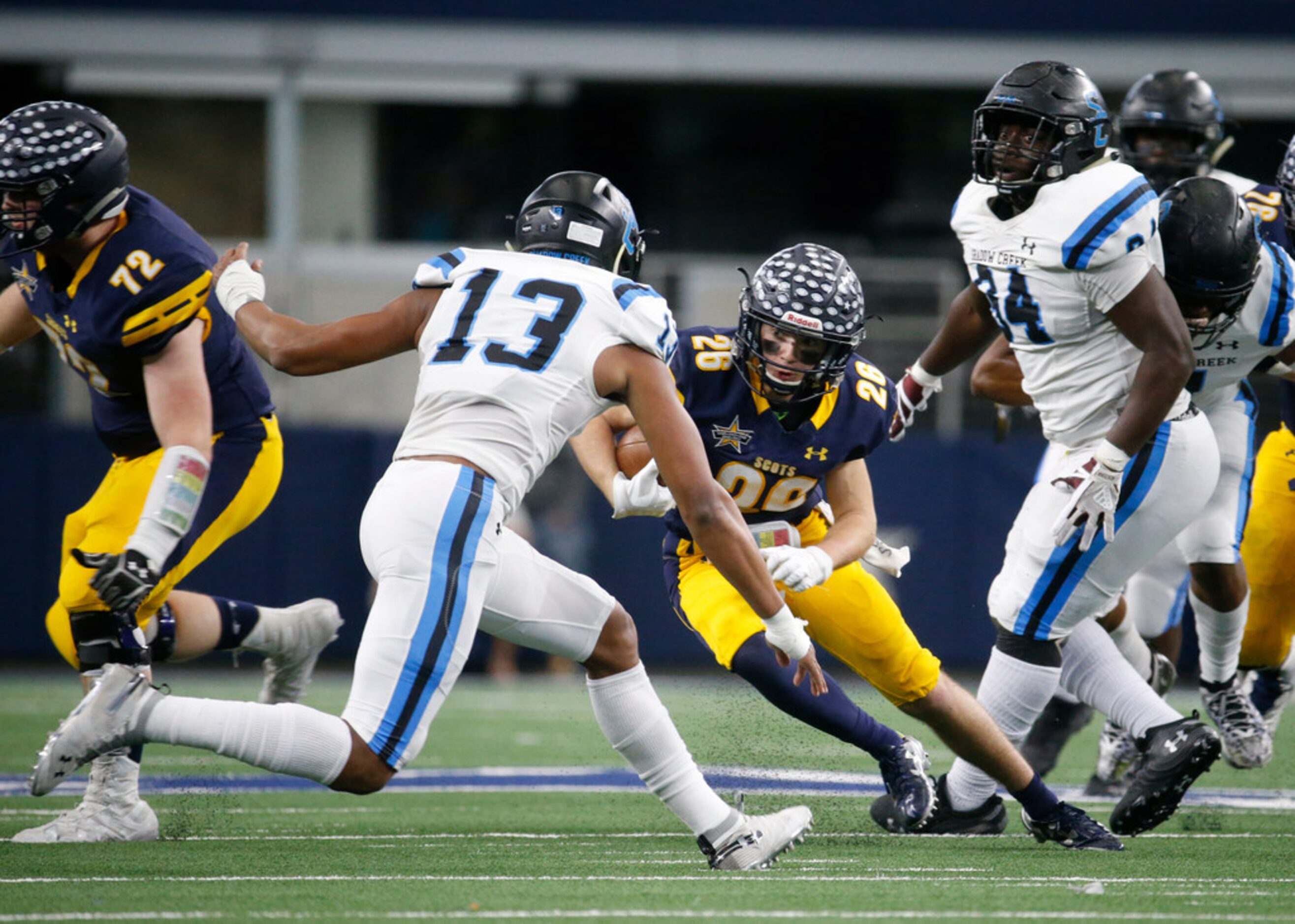 Highland Park's Harris Hurley (26) runs the ball into Shadow Creek's Ronald Nunnery during...