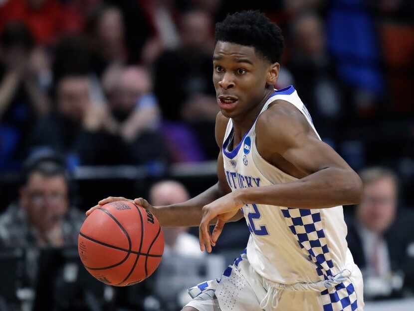 FILE - In this March 15, 2018, file photo, Kentucky guard Shai Gilgeous-Alexander moves the...