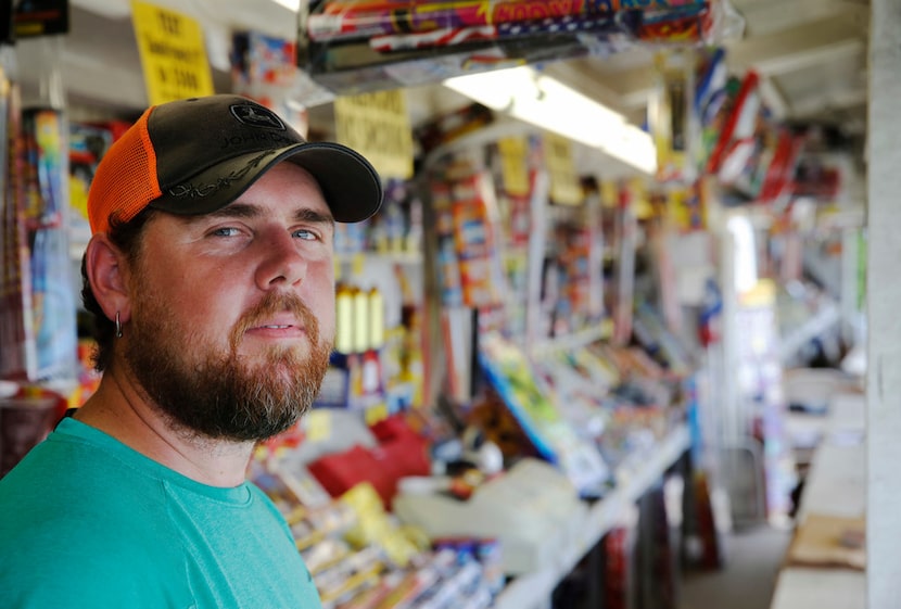 Zack Clindaniel stays in a tent next to Alamo Fireworks near Wilmer. He and his fiancée,...