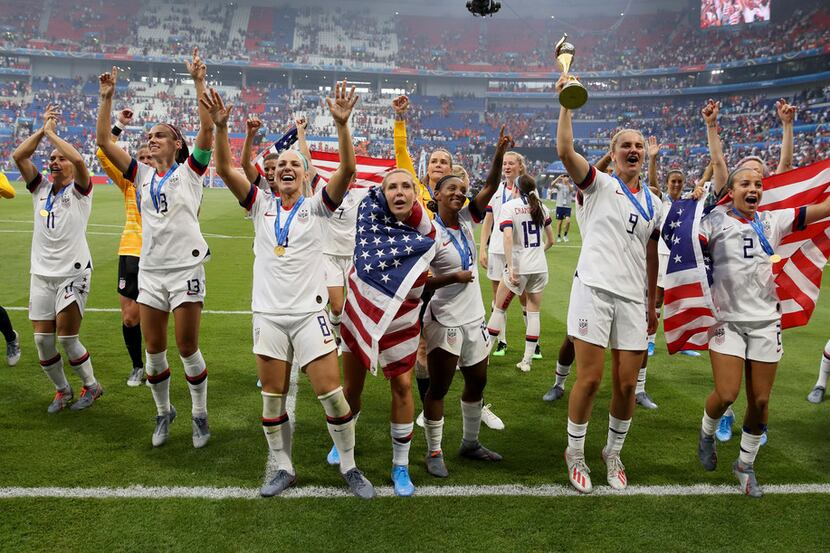 U.S. players celebrate their victory in the Women's World Cup final soccer match between...