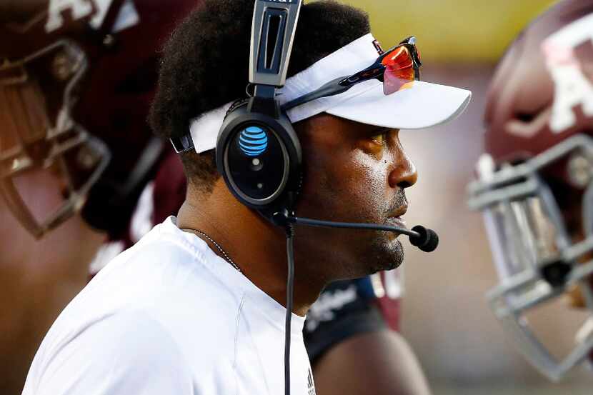 Texas A&M Aggies head coach Kevin Sumlin's players come to the sidelines during the second...