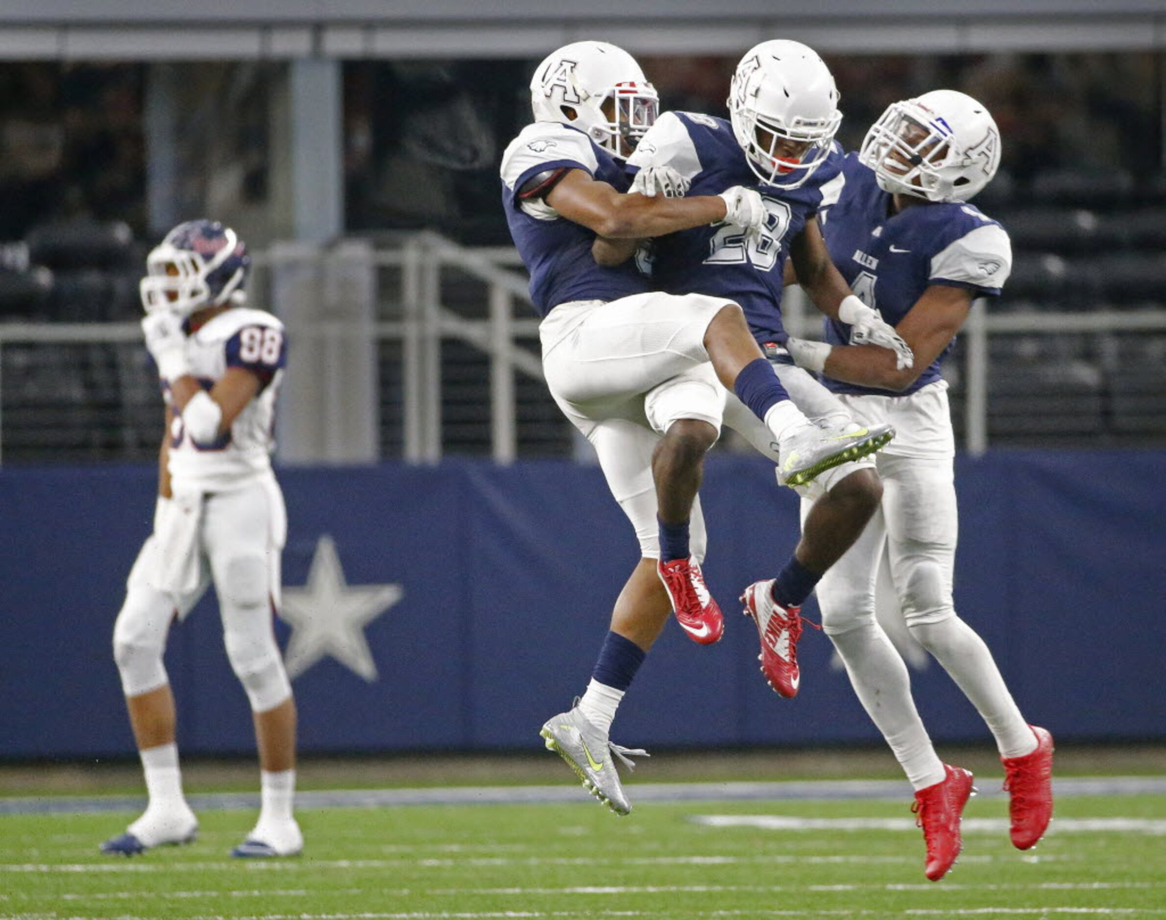 Allen defenders Anthony Taylor, Nick Allen and Jaylon Jones, left to right, celebrate taking...