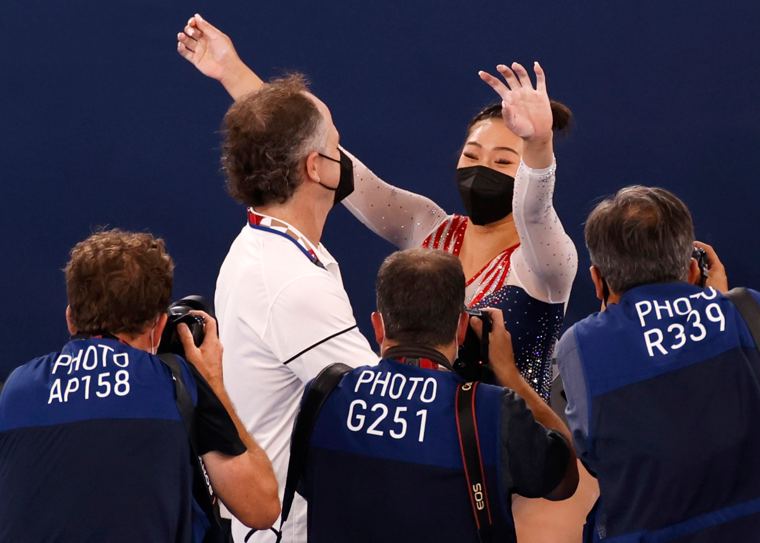 USA’s Sunisa Lee hugs her coach Jeff Graba after winning gold in the women’s all-around...