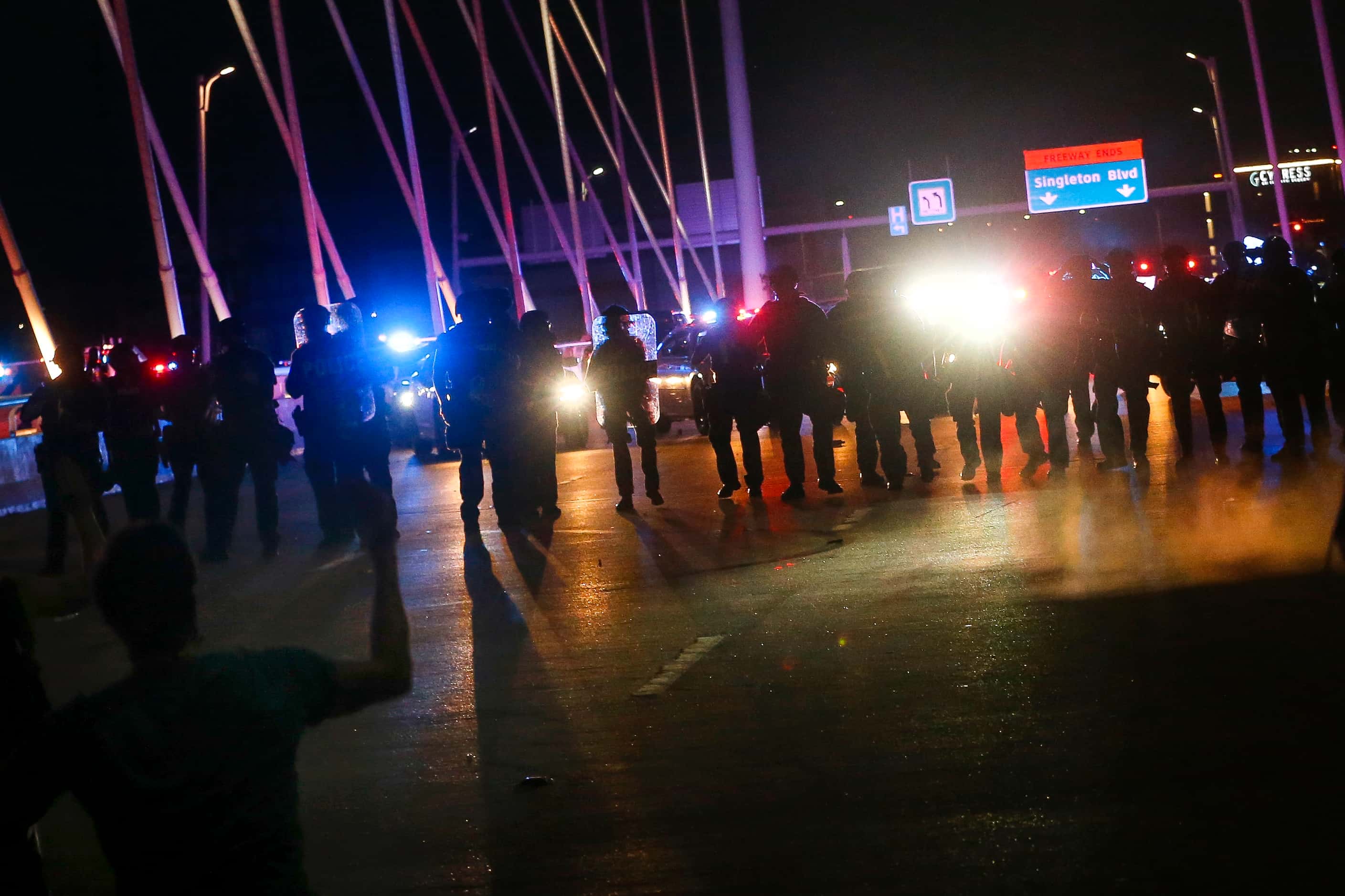 Protesters march onto the Margaret Hunt Hill Bridge as the demonstrate against police...