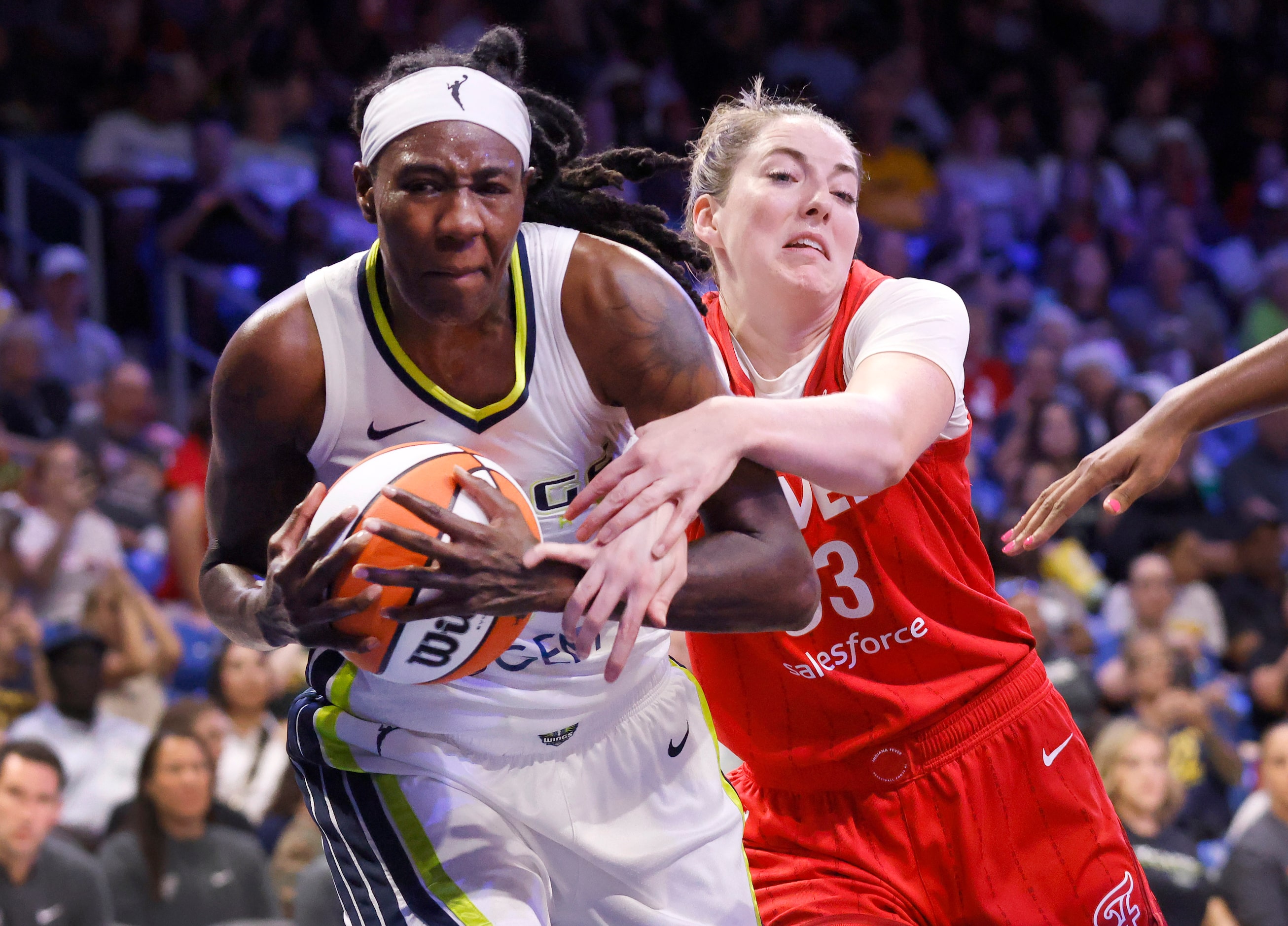 Indiana Fever forward Katie Lou Samuelson (33) tries to keep Dallas Wings forward Natasha...