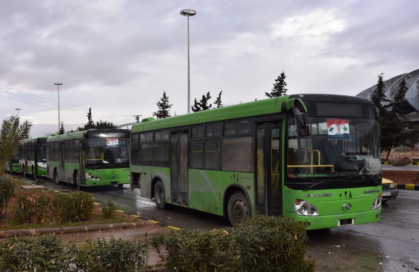 Buses to be used to evacuate civilians leaving rebel-held areas of Aleppo returned to the...