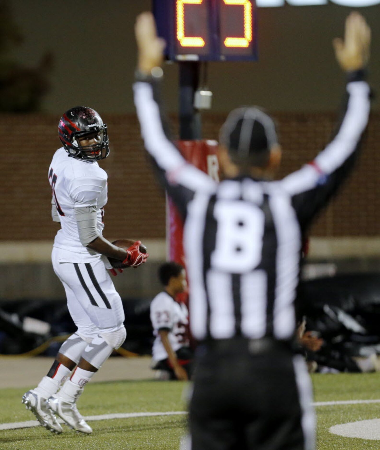 Colleyville Heritage sophomore wide receiver Ke'von Ahmad (20) scores a touchdown during the...