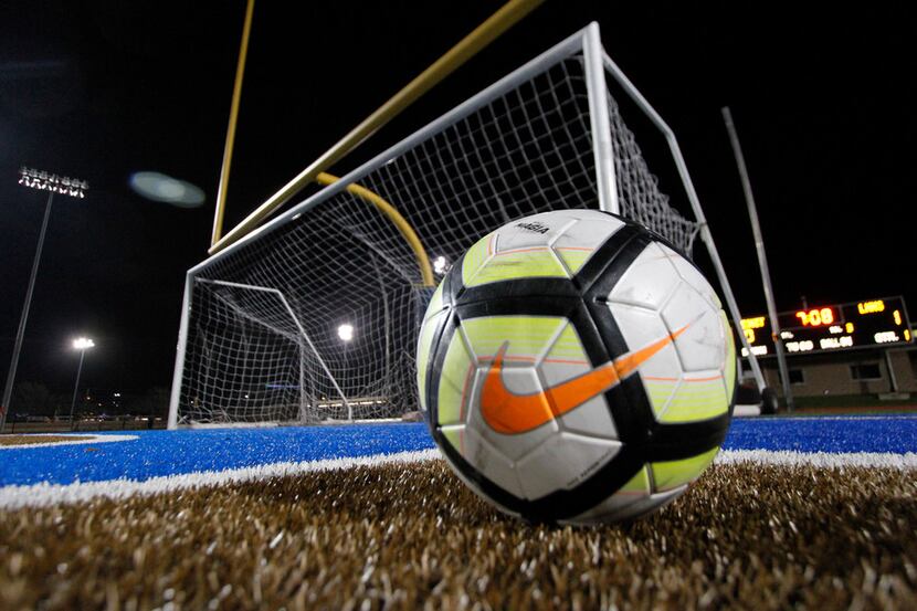 A soccer ball awaits the start of the second half action between Dallas Jesuit and lake...