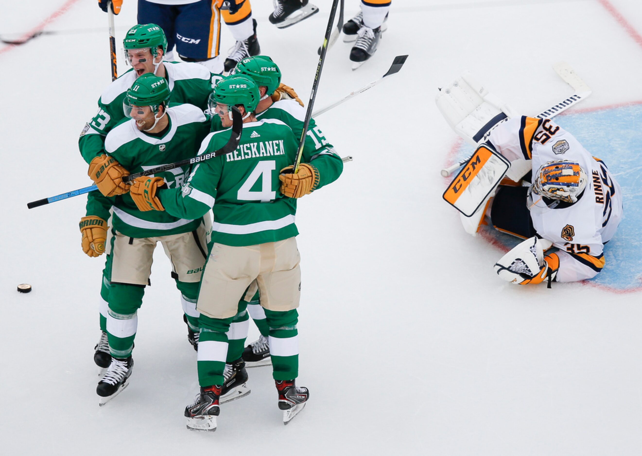 The Dallas Stars celebrate after Dallas Stars left wing Blake Comeau (15) scored a goal on...