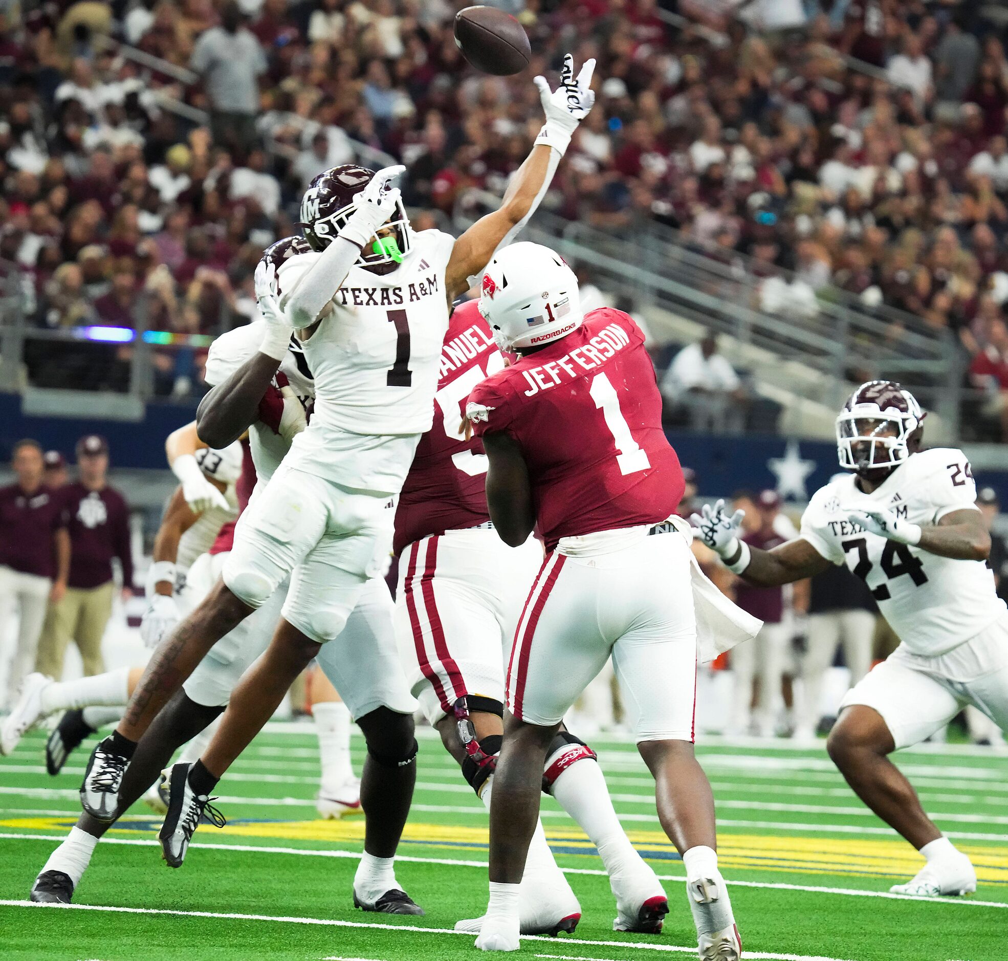 Texas A&M defensive back Bryce Anderson (1) tips a pass by Arkansas quarterback KJ Jefferson...