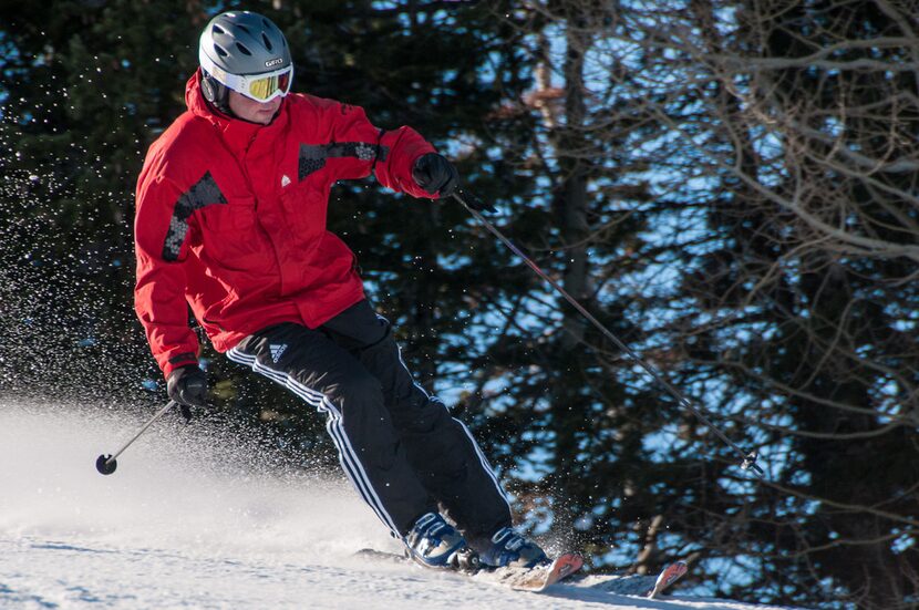 A skier descends a trail at the Deer Valley Resort in Park City, Utah.  Even though the...