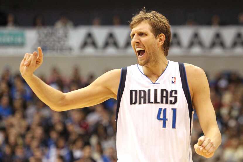 Dallas' Dirk Nowitzki (41)  reacts as he heads back to play defense after a Mavericks' score...