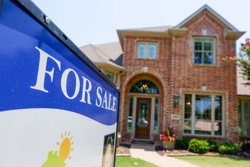 A for sale sign is displayed outside a house in Plano last weekend. U.S. home prices saw...