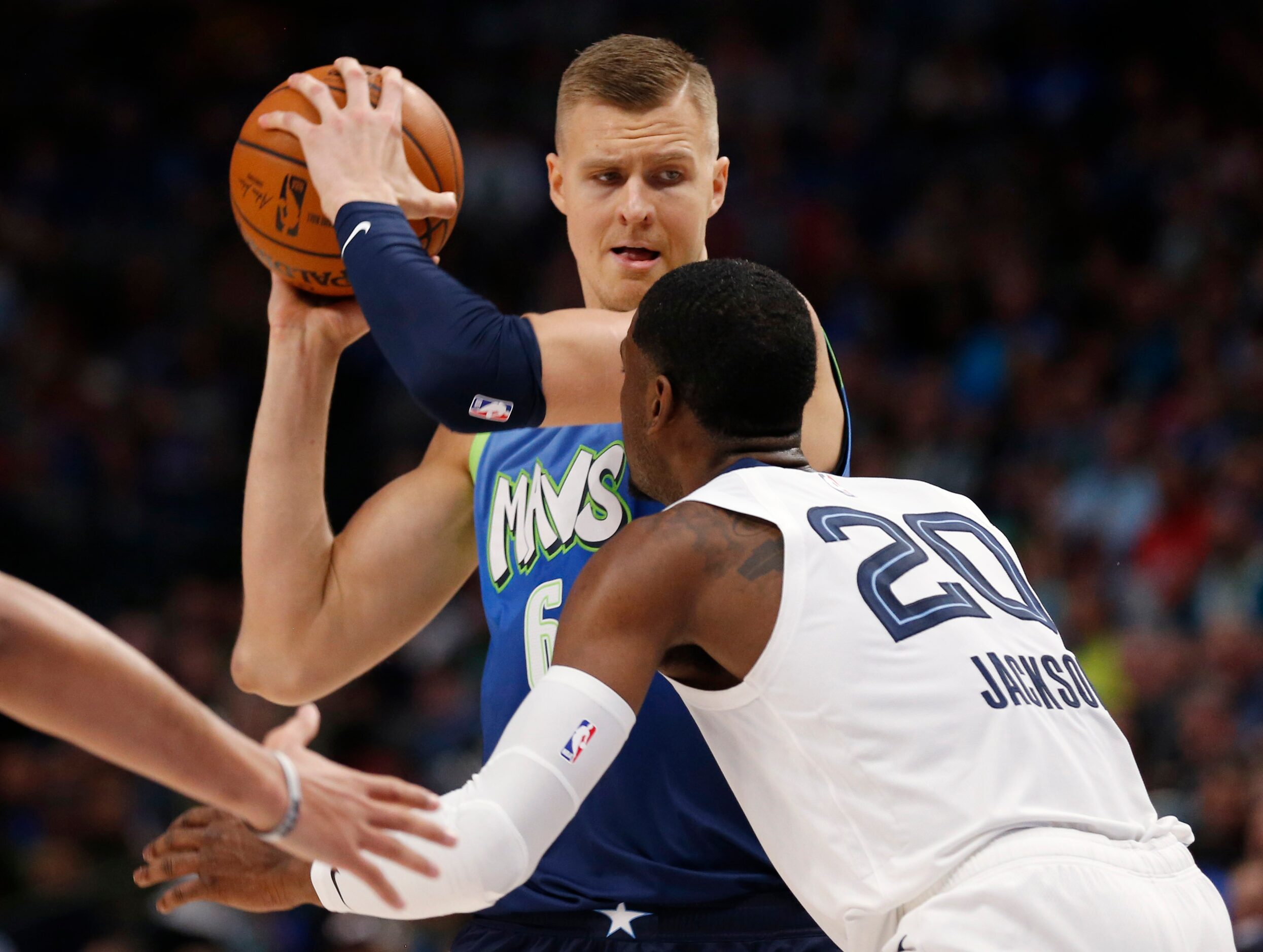 Dallas Mavericks forward Kristaps Porzingis (6) looks back as Memphis Grizzlies guard Josh...