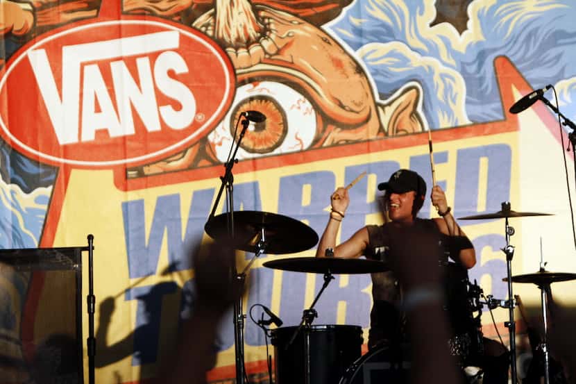 Kenneth Downey of the band Too Close To Touch performs at the Vans Warped Tour, on June 24,...
