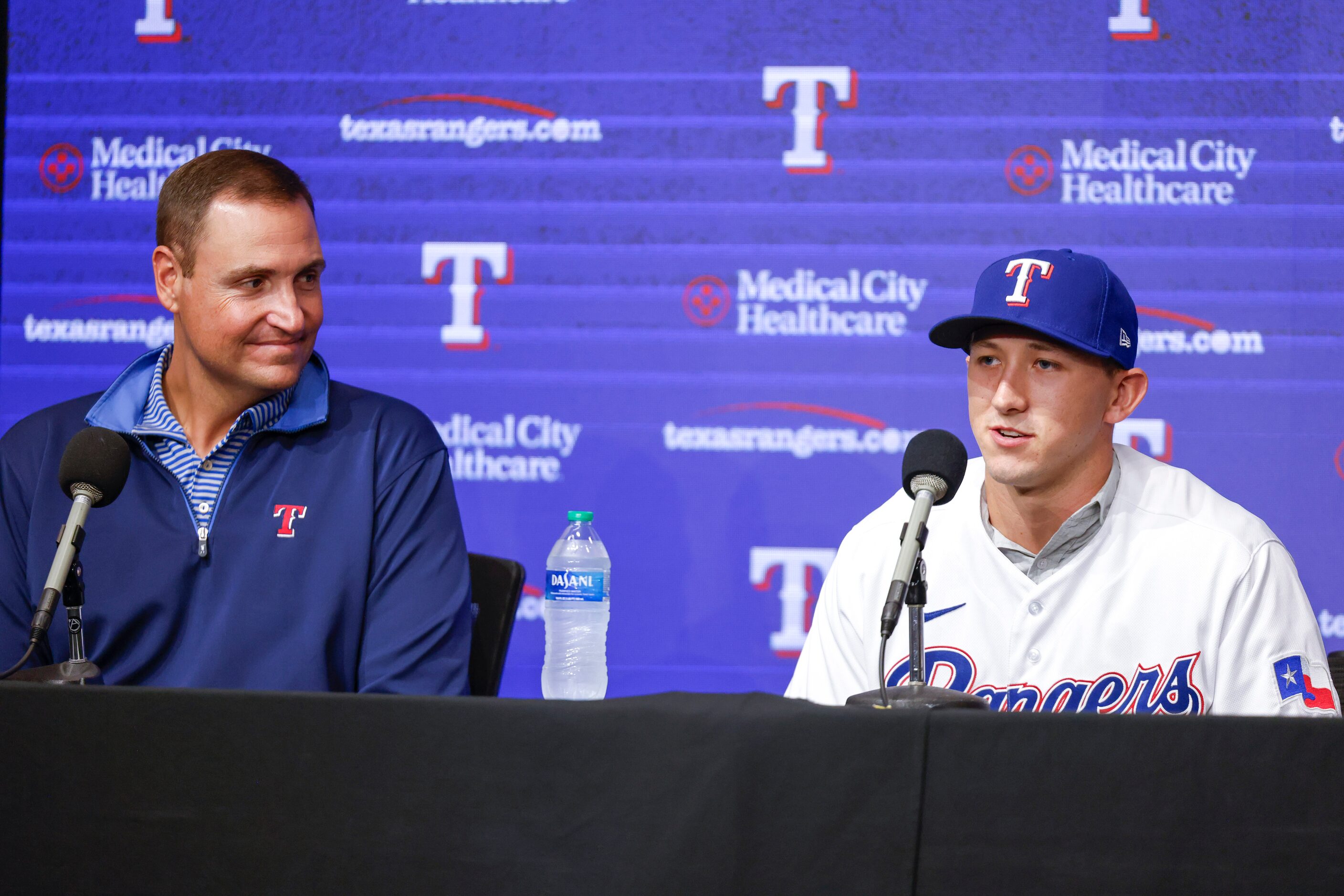 Texas Rangers Executive Vice President Chris Young, (left), watches Rangers top pick Wyatt...