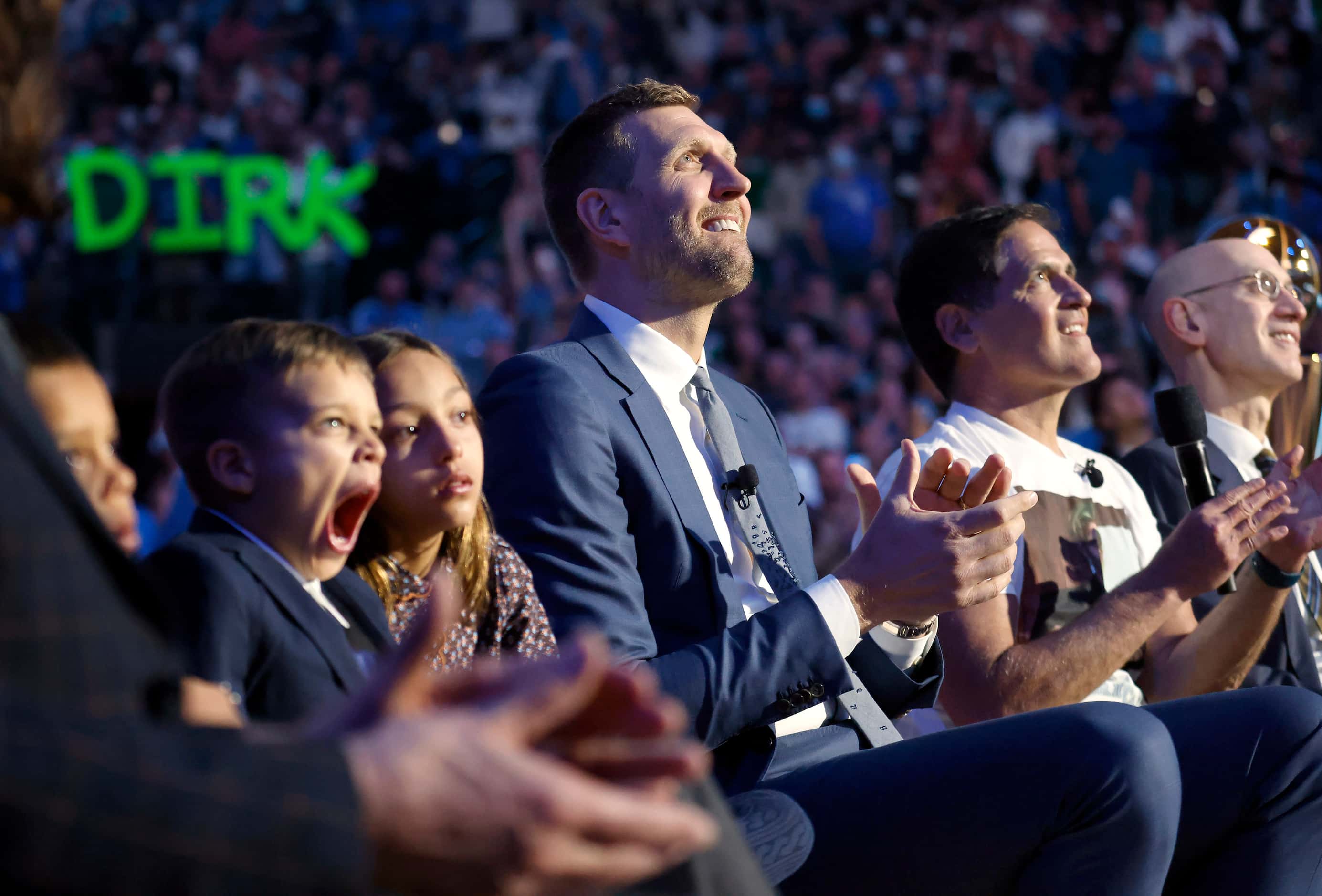 Sitting alongside his children, former Dallas Mavericks All-Star Dirk Nowitzki watches a...