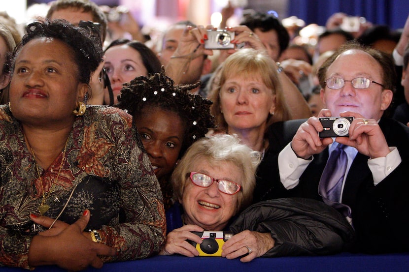 Dr. Ruth Westheimer, foreground center, watches President Barack Obama and first lady...