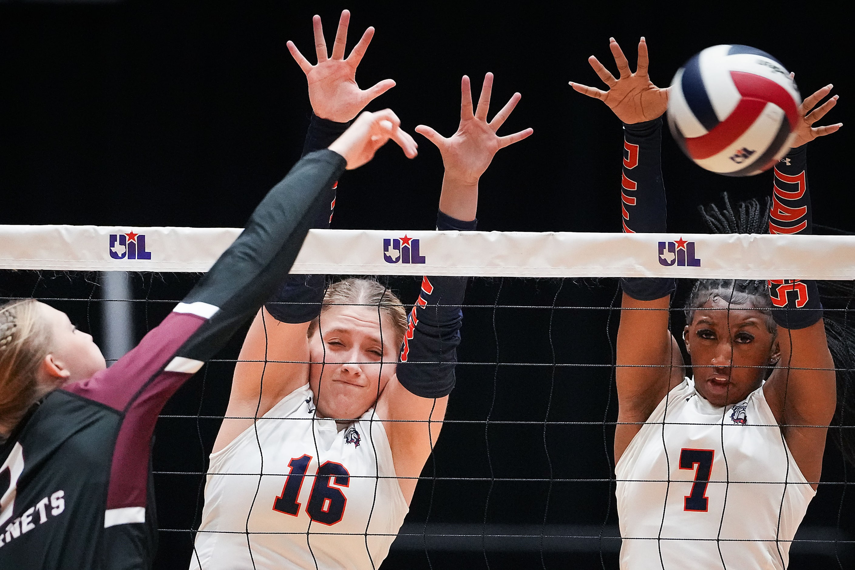 McKinney North's Madison Trayler (16) and Kaitlyn Jefferson (7) go up for a block against...