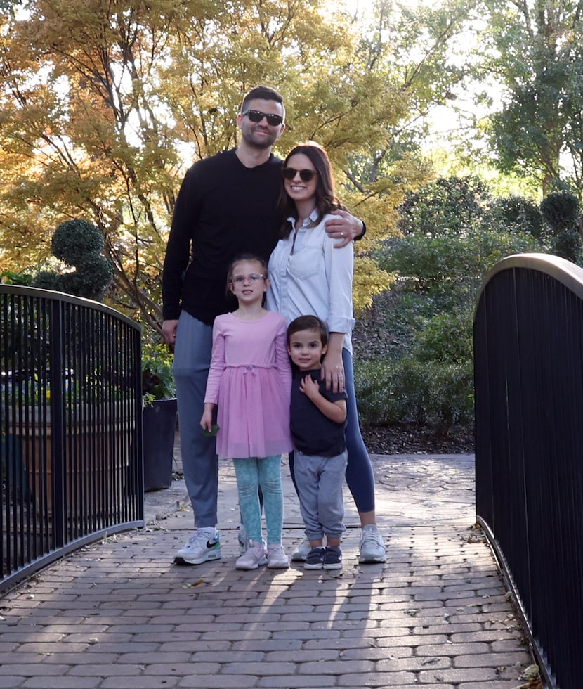 Jake and Kristin Kemp pose for a family photo along with daughter Nora, 5, left, and son...