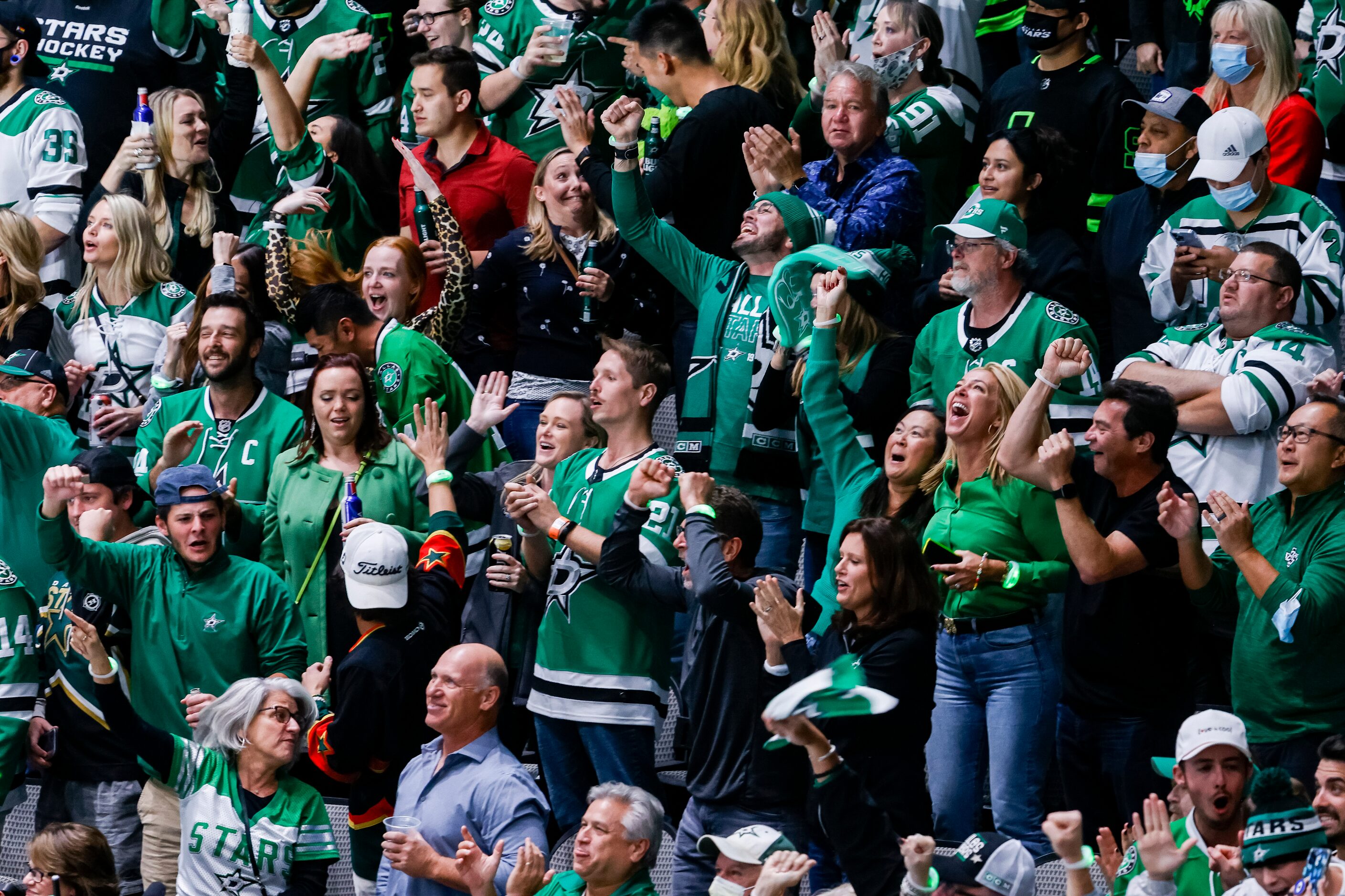 Fans celebrate Dallas Stars right wing Denis Gurianov (34) game winning score during the...