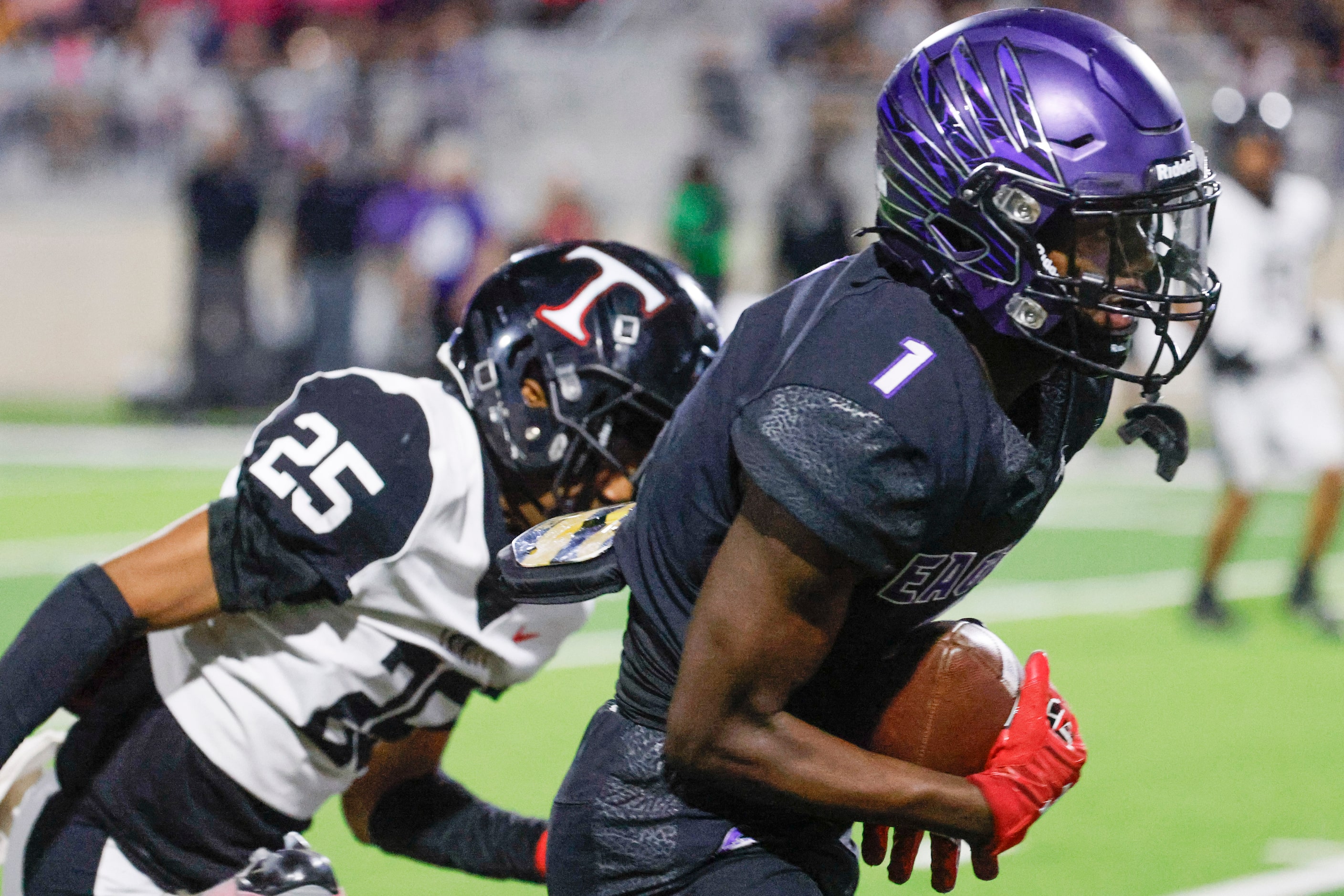 Trinity High’s Antawn McGee (left) runs behind Crowley High’s Antayvious Ellis as he runs...